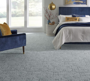 Bedroom with blue-gray textured carpet