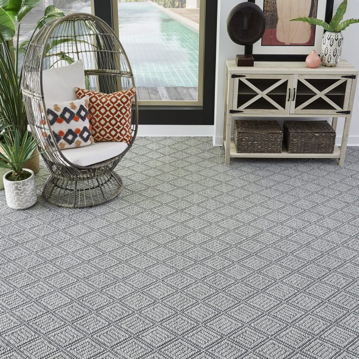 Textured gray and white carpet in a botanical sunroom