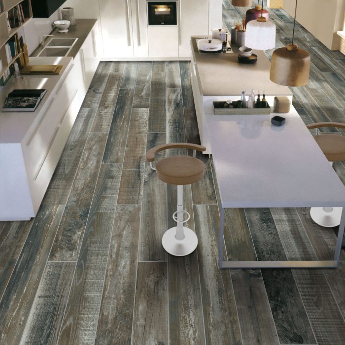 Modern kitchen with blue and gray wood grain laminate flooring