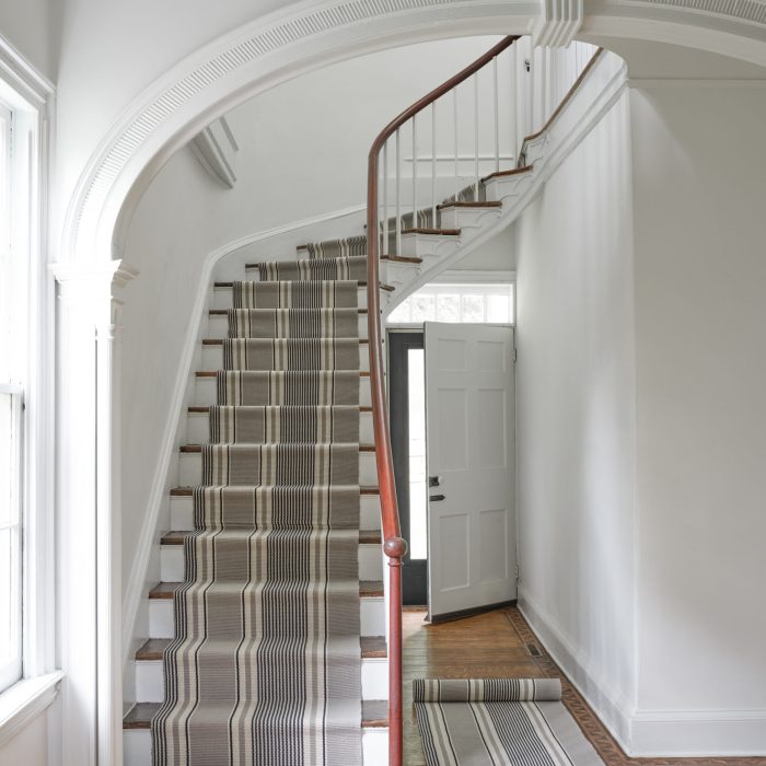 Custom black and white carpet along staircase