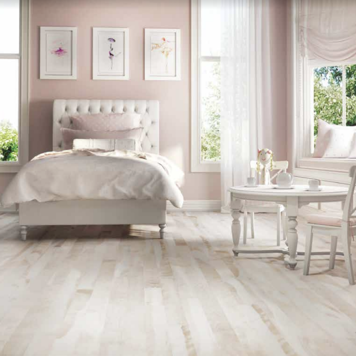 Children's bedroom with pink walls and light tone hardwood flooring